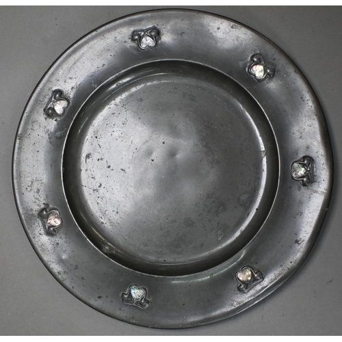 970 - An Archibald Knox design Tudric pewter circular tray no 0113 with stylised foliate bosses inset with... 