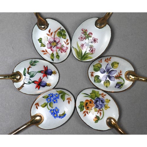 103 - A cased set of six silver gilt coffee spoons with floral enamelled bowls and seal finials, William S... 