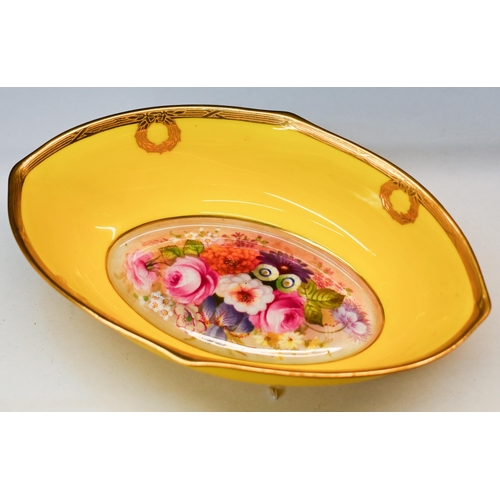 482 - A Royal Worcester oval bowl, painted with flowers by Edward Phillips, signed, on yellow ground, the ... 