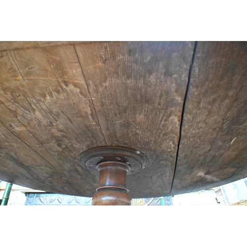 675 - A Victorian mahogany library drum table, the gilt tooled tan leather inset revolving top with four a... 