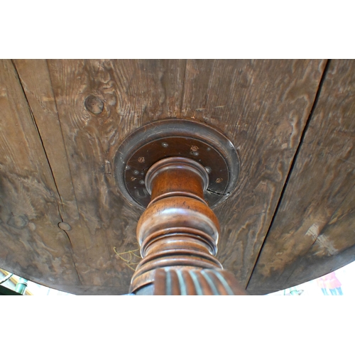 675 - A Victorian mahogany library drum table, the gilt tooled tan leather inset revolving top with four a... 