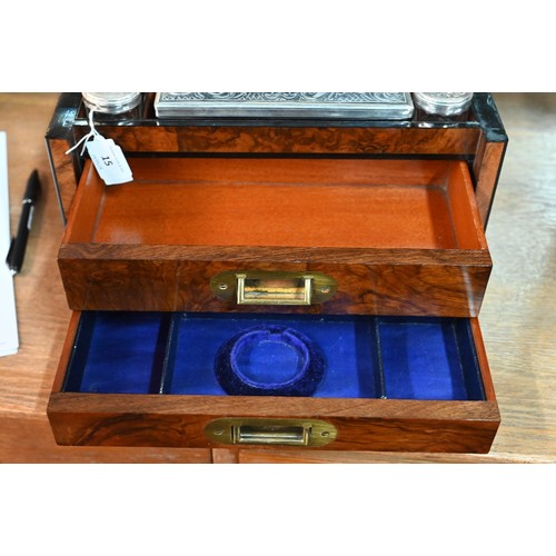 15 - A Victorian walnut dressing case by Greaves (New St, Birmingham), fitted with silver-handled manicur... 