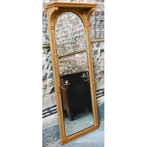 655 - An Victorian style giltwood framed canopy top pier glass, with bevel edged mirror plate, flanked by ... 