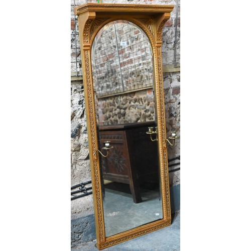 655 - An Victorian style giltwood framed canopy top pier glass, with bevel edged mirror plate, flanked by ... 