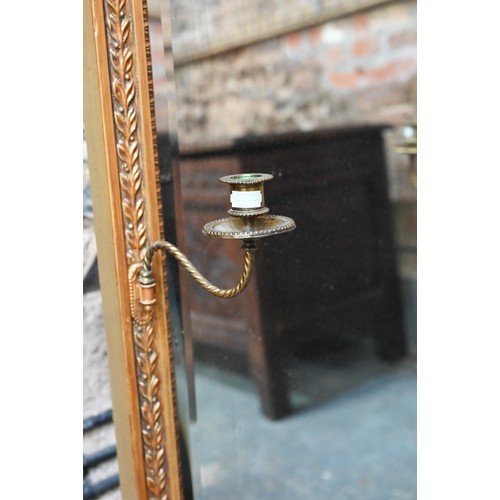 655 - An Victorian style giltwood framed canopy top pier glass, with bevel edged mirror plate, flanked by ... 