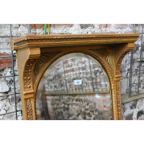 655 - An Victorian style giltwood framed canopy top pier glass, with bevel edged mirror plate, flanked by ... 