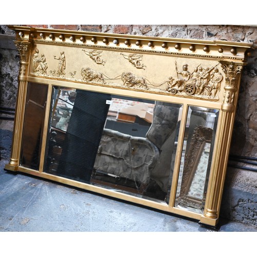 656 - A Victorian style giltwood framed landscape over mantel mirror, the deep frieze with applied lion an... 