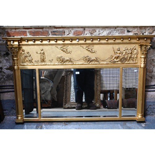 656 - A Victorian style giltwood framed landscape over mantel mirror, the deep frieze with applied lion an... 