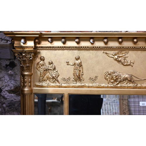 656 - A Victorian style giltwood framed landscape over mantel mirror, the deep frieze with applied lion an... 