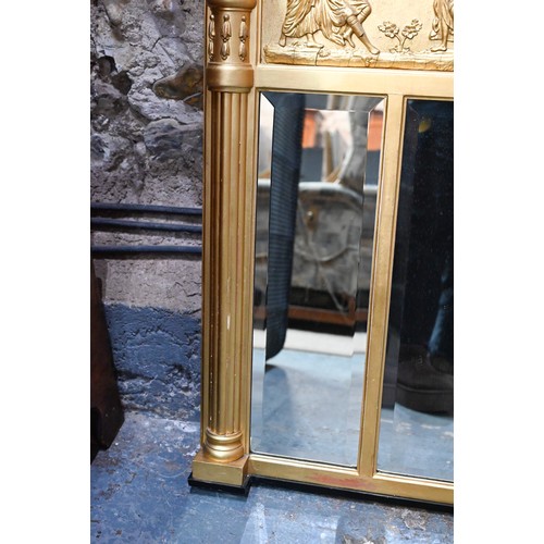 656 - A Victorian style giltwood framed landscape over mantel mirror, the deep frieze with applied lion an... 