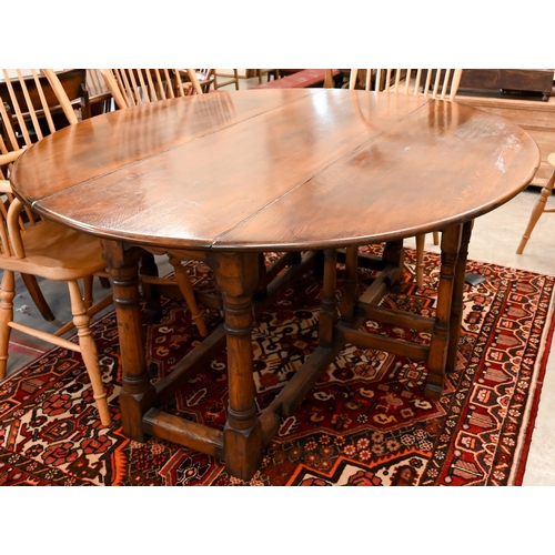 7 - A contemporary oak drop leaf 'wake' dining table, the oval top raised on a gateleg frame, 169 x 48 (... 