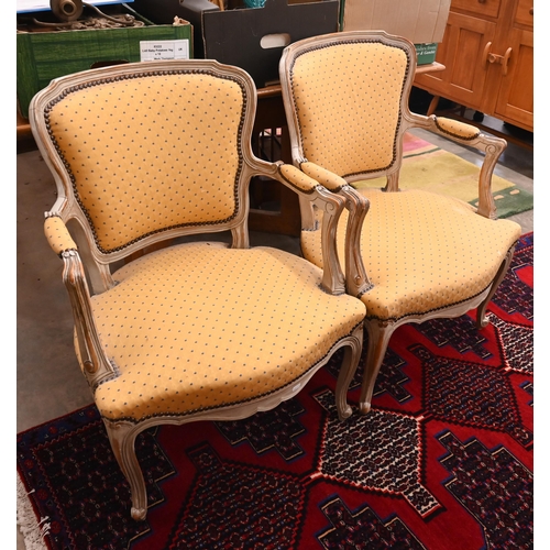 44 - A pair of French painted wood fauteuil armchairs with spotted yellow padded upholstery (2)