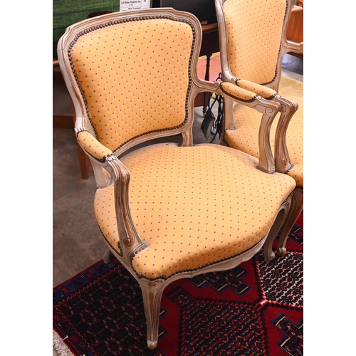 44 - A pair of French painted wood fauteuil armchairs with spotted yellow padded upholstery (2)