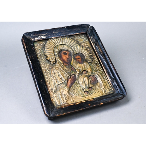 494 - An antique Coptic icon of Mary and Jesus, with painted features in embossed brass surround, 17 x 14 ... 