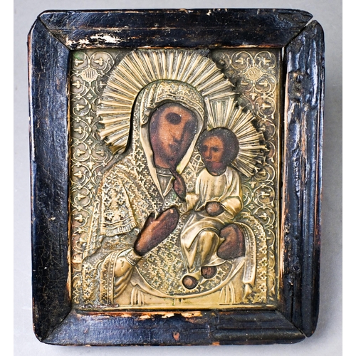 494 - An antique Coptic icon of Mary and Jesus, with painted features in embossed brass surround, 17 x 14 ... 