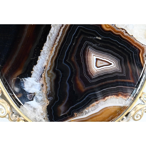 462 - A large oval agate plaque in gilt metal scroll brooch mount (fitting missing), 7.8 x 5.6cm (the agat... 