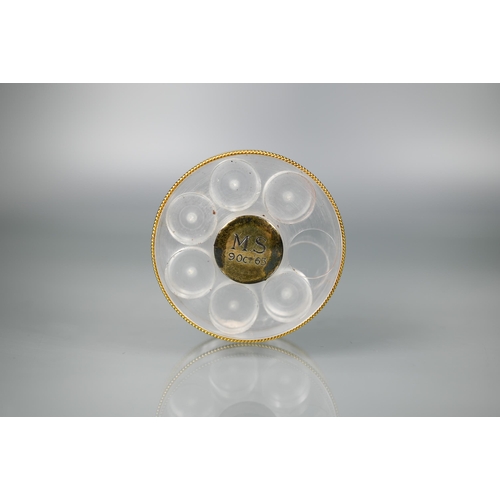 460 - Asprey - a round lucite sliding pill box with six recesses, vermeil edging and silver gilt centres, ... 