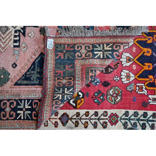 186 - A mid-century Turkish rug, the faded red ground rug with geometric design, 228 cm x 164 cm