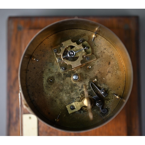 549 - A vintage barograph in glazed oak case, 32 cm wide, to/w two boxes of spare charts and a bottle of i... 