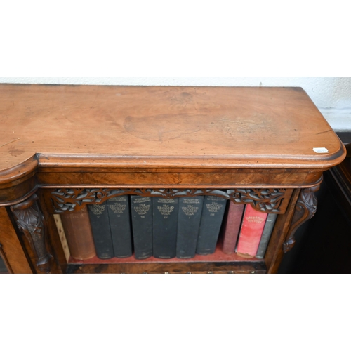 1 - A Victorian walnut breakfront bookcase with fret-cut and carved decorative mouldings, glazed central... 