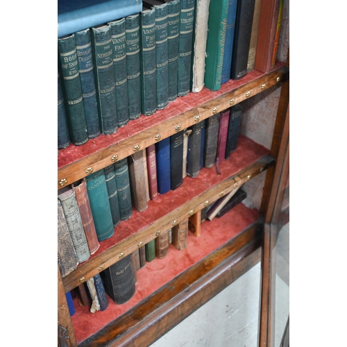 1 - A Victorian walnut breakfront bookcase with fret-cut and carved decorative mouldings, glazed central... 