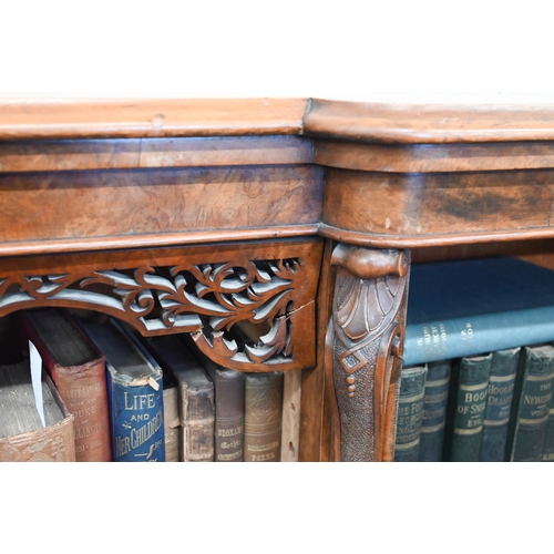 1 - A Victorian walnut breakfront bookcase with fret-cut and carved decorative mouldings, glazed central... 