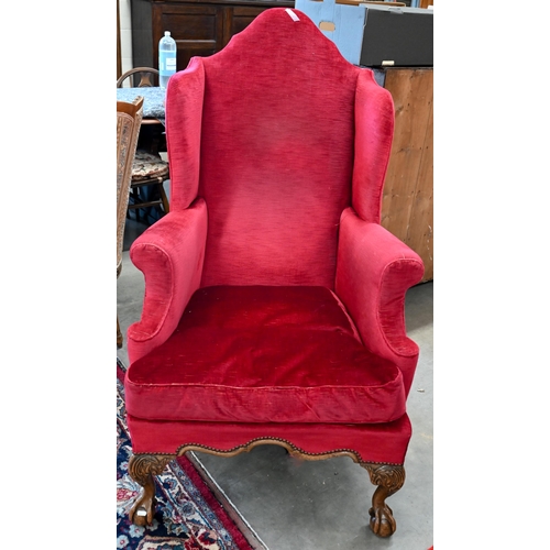 101 - A walnut framed Queen Anne style wingback armchair, acanthus carved cabriole front legs with ball an... 