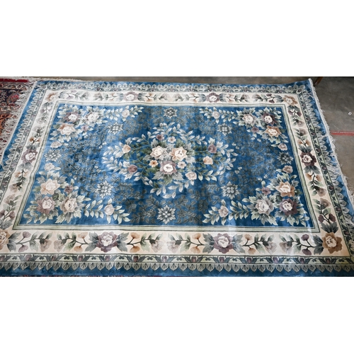 104 - A Chinese cut wool blue ground floral rug, 277 x 184 cm