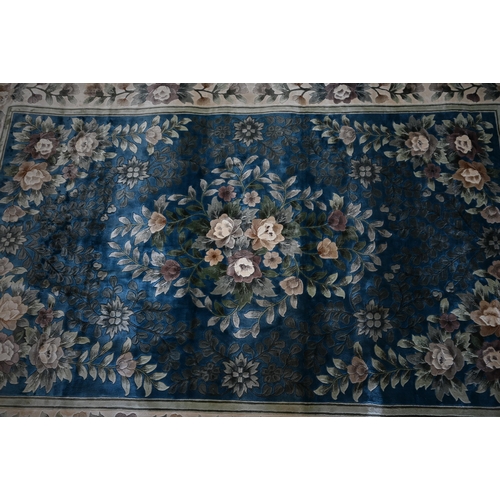 104 - A Chinese cut wool blue ground floral rug, 277 x 184 cm