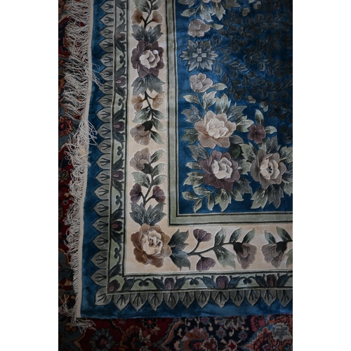 104 - A Chinese cut wool blue ground floral rug, 277 x 184 cm