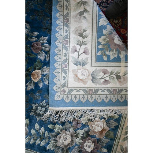 104 - A Chinese cut wool blue ground floral rug, 277 x 184 cm