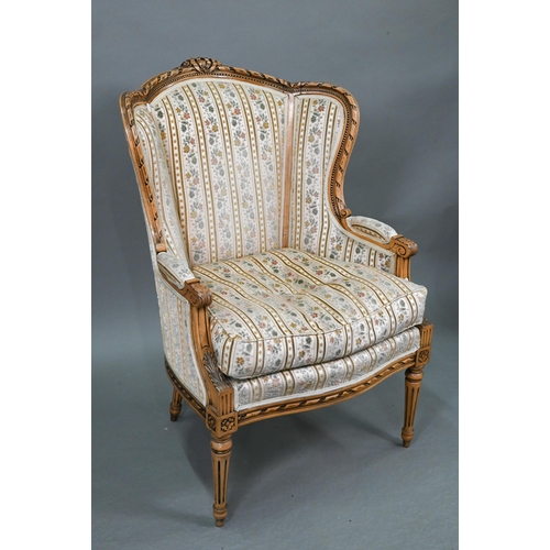 106 - A French wingback armchair, 20th century, floral brocade-style striped fabric