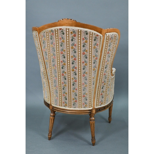 106 - A French wingback armchair, 20th century, floral brocade-style striped fabric