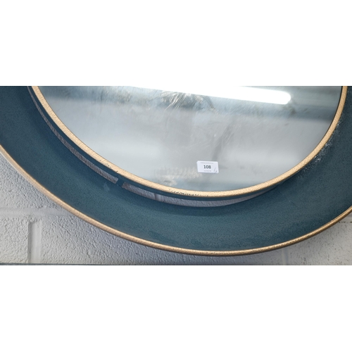 108 - Two modern circular metal framed wall mirrors, 88 cm diam and 76 cm diam, to/w rectangular mirror in... 