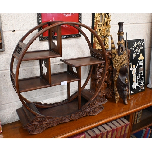 112 - A Chinese rosewood circular display unit with staggered shelves and carved cloud design base to/w tw... 