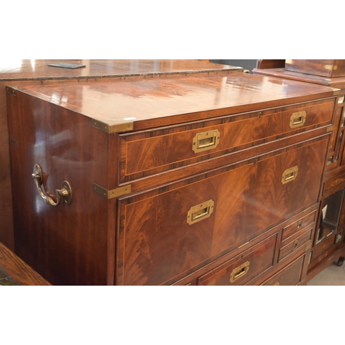 113 - A reproduction mahogany brass mounted secretaire chest on stand with arrangement of drawers surround... 