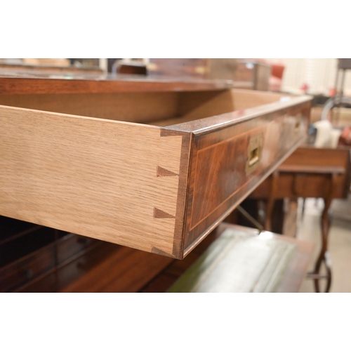 113 - A reproduction mahogany brass mounted secretaire chest on stand with arrangement of drawers surround... 