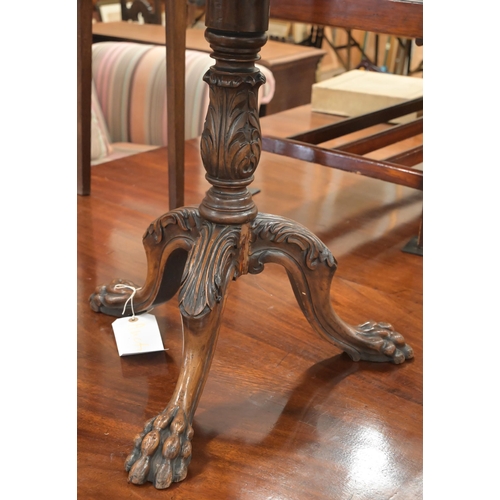 116 - A mahogany occasional table with scalloped tilt-top on carved tripod base with paw feet, 56 cm diam ... 