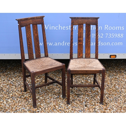 119 - A set of six Liberty Arts & Crafts oak dining chairs with rush seats, circa 1900 (6)Illustrated ... 