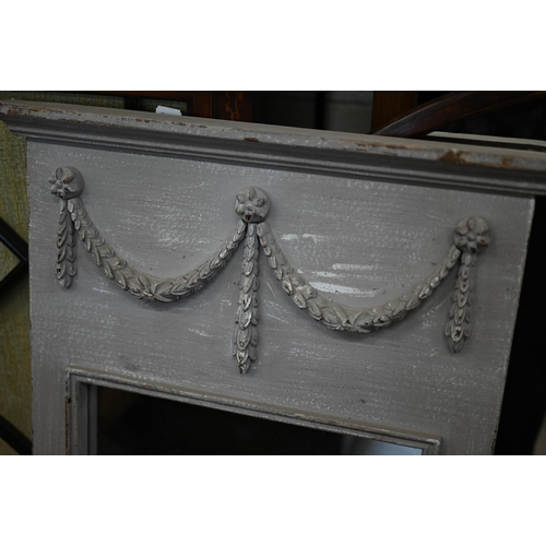 121 - A pair of French style trumeau mirrors in grey painted frames with neoclassical garlands, 50 cm wide... 