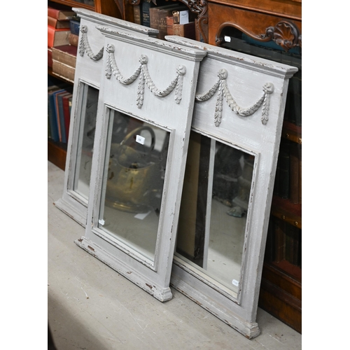 122 - A trio of French style trumeau mirrors in grey painted frames with neoclassical garlands, 50 cm wide... 