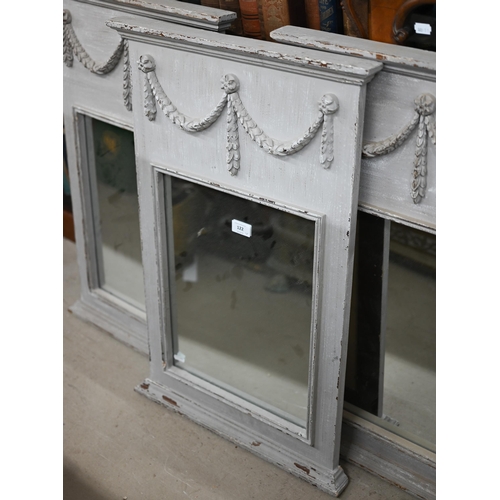 122 - A trio of French style trumeau mirrors in grey painted frames with neoclassical garlands, 50 cm wide... 