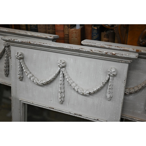 122 - A trio of French style trumeau mirrors in grey painted frames with neoclassical garlands, 50 cm wide... 