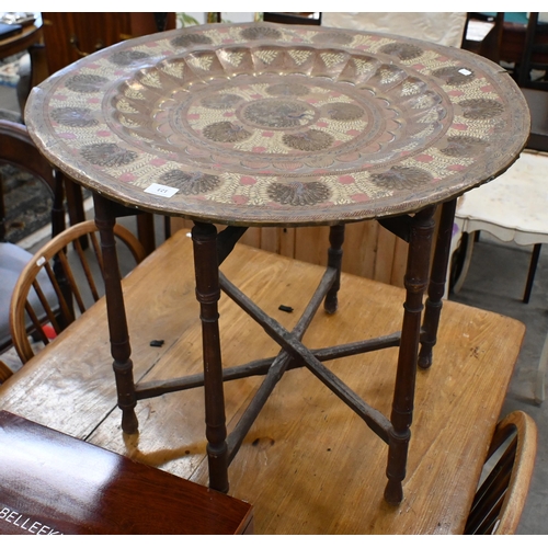 123 - # A vintage Indian Benares brass tray top table with engraved and enamelled Peacock design, on foldi... 