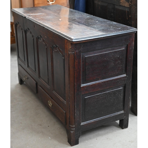 124 - A Georgian oak mule chest, of traditional panelled construction with hinged top and two drawers, 134... 