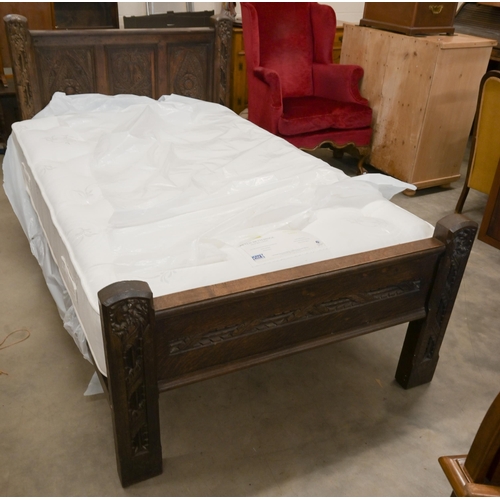 125 - A carved oak single bed (antique and later components) c/w Peter Betteridge Milton 1400 mattress