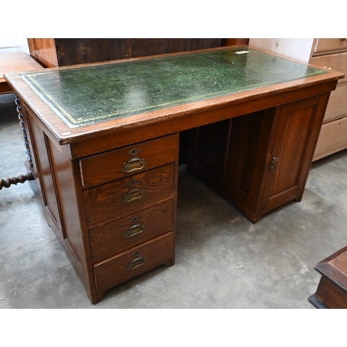 13 - An oak kneehole desk with gilt-tooled green leather top over four drawers (left) and panelled cupboa... 