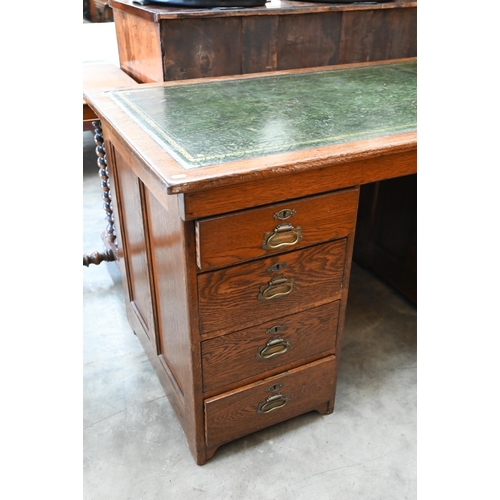 13 - An oak kneehole desk with gilt-tooled green leather top over four drawers (left) and panelled cupboa... 