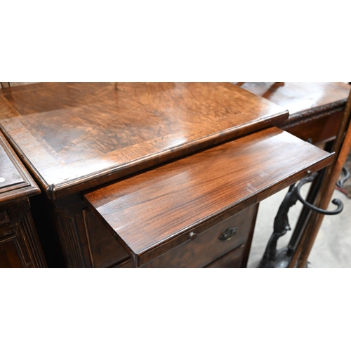 130 - A small antique walnut chest with cross and featherbanded top over brushing slide and three graduati... 