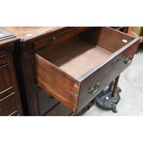 130 - A small antique walnut chest with cross and featherbanded top over brushing slide and three graduati... 